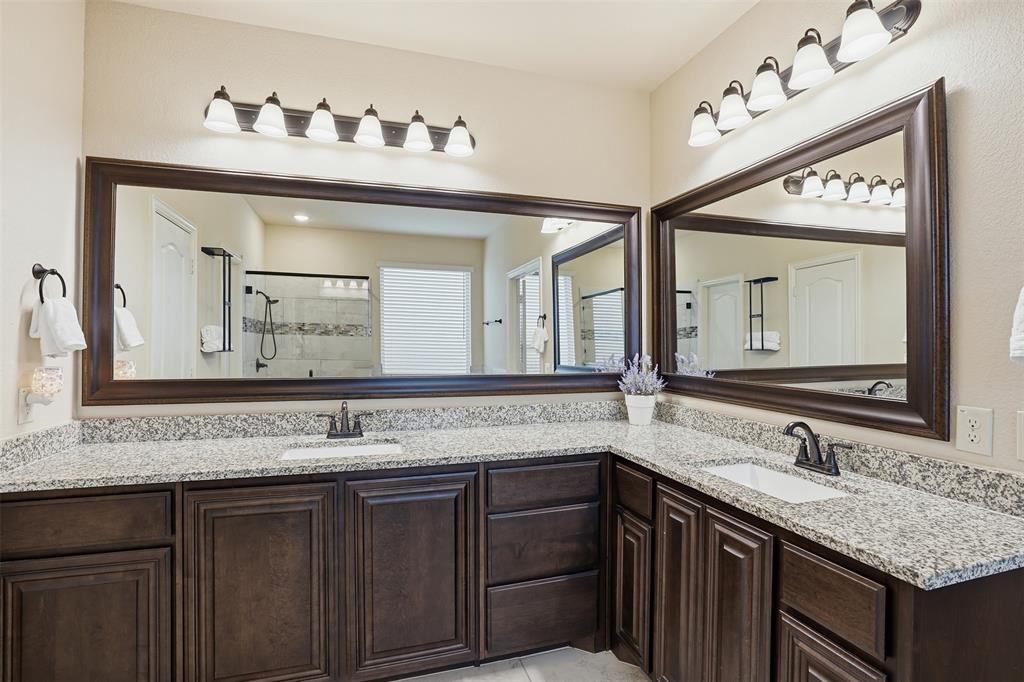 4002 Grove Valley Road Midlothian, TX 76065 - Photo 22 of 40 a bathroom with a granite countertop sink and a mirror