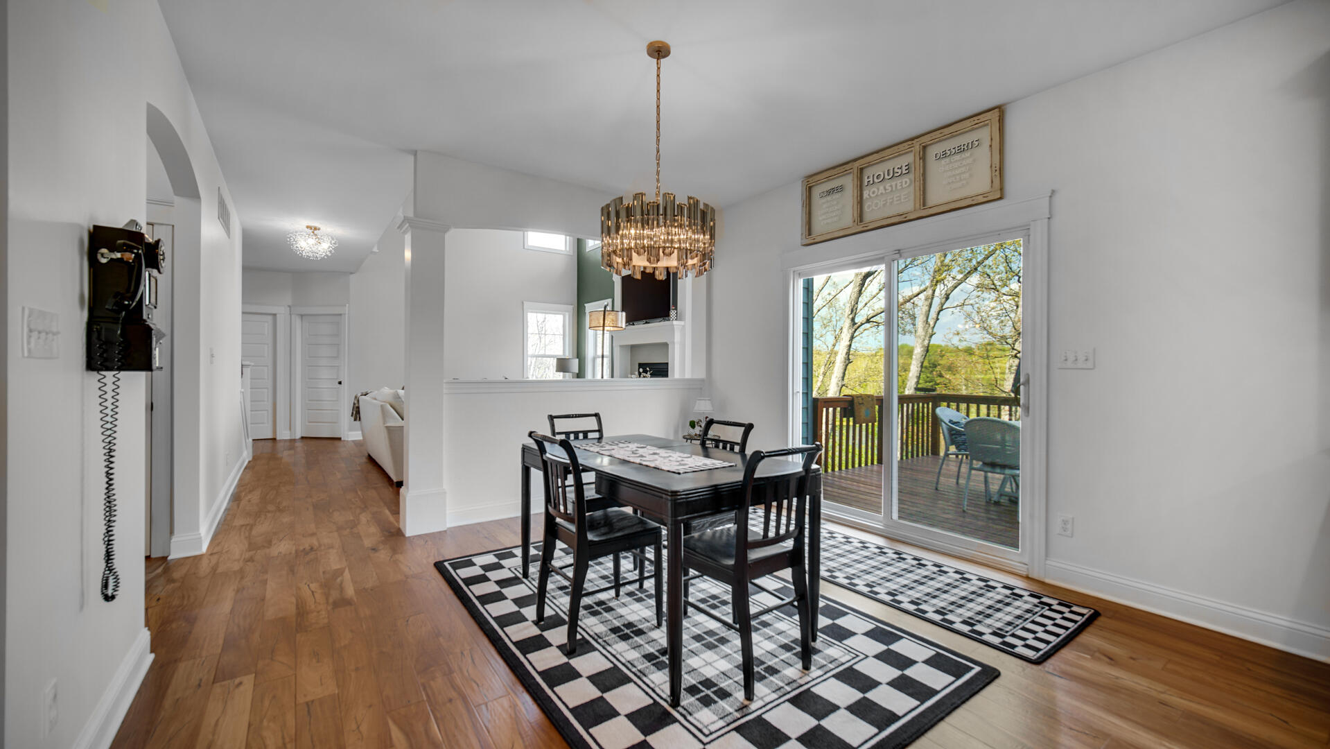 12871 Baker Court Crown Point, IN 46307 - Photo 12 of 50 a view of a dining room with furniture window and wooden floor