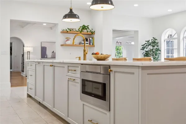 a kitchen with a sink and cabinets