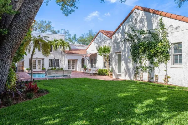 a front view of house with yard and outdoor seating