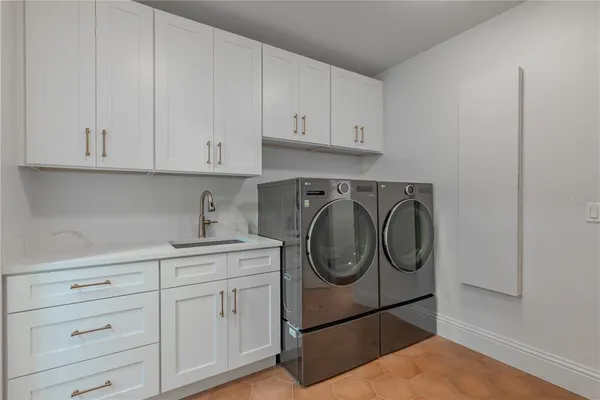 a utility room with cabinets