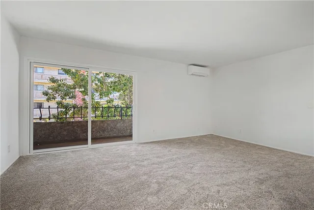 a view of an empty room with a balcony