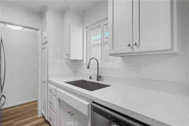 a bathroom with a toilet a sink a mirror a bathtub and vanity