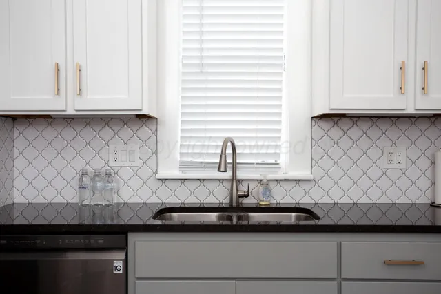 a view of a sink and a window