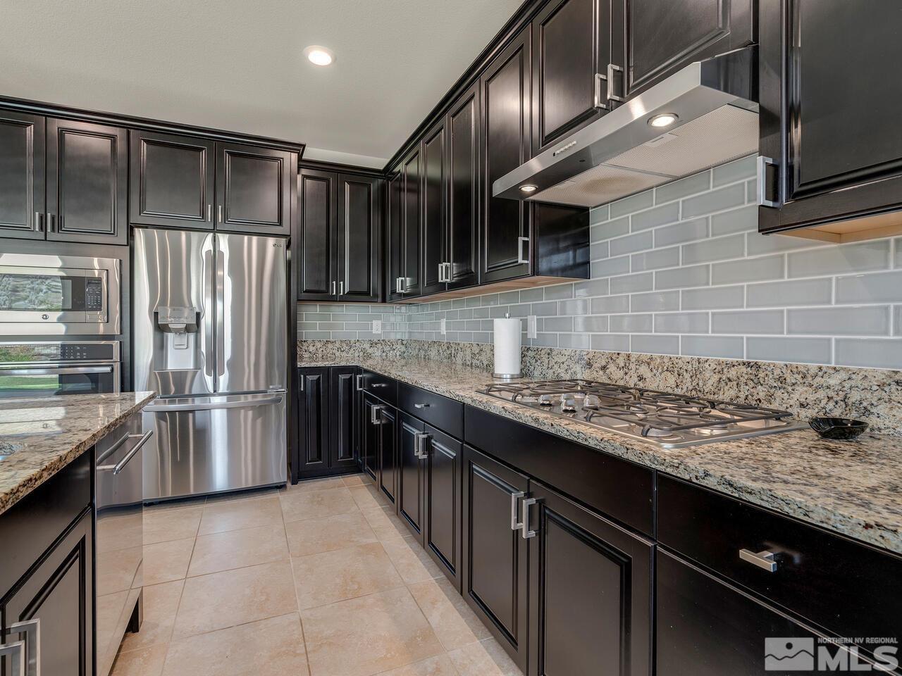 1770 Scott Valley Road Reno, NV 89523 - Photo 11 of 29 a kitchen with stainless steel appliances granite countertop a sink stove and refrigerator