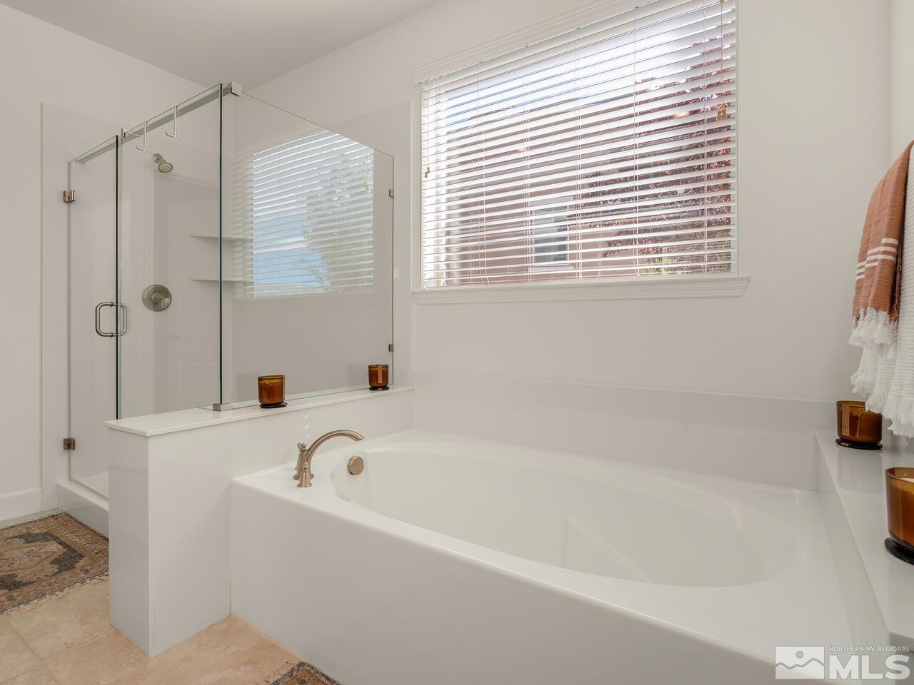1770 Scott Valley Road Reno, NV 89523 - Photo 15 of 29 a bathroom with a bathtub and a shower