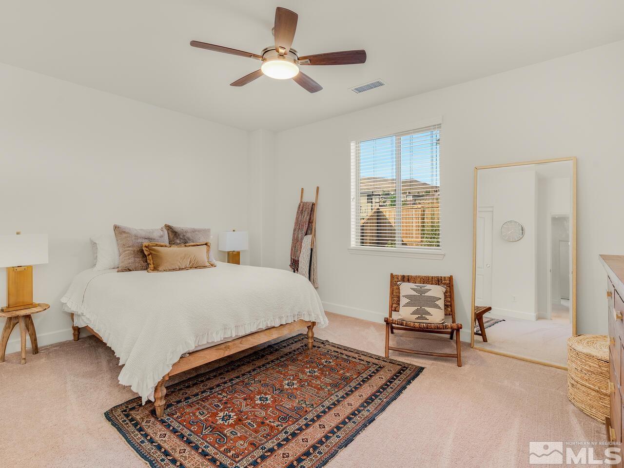 1770 Scott Valley Road Reno, NV 89523 - Photo 17 of 29 a bedroom with a bed rug and wooden floor