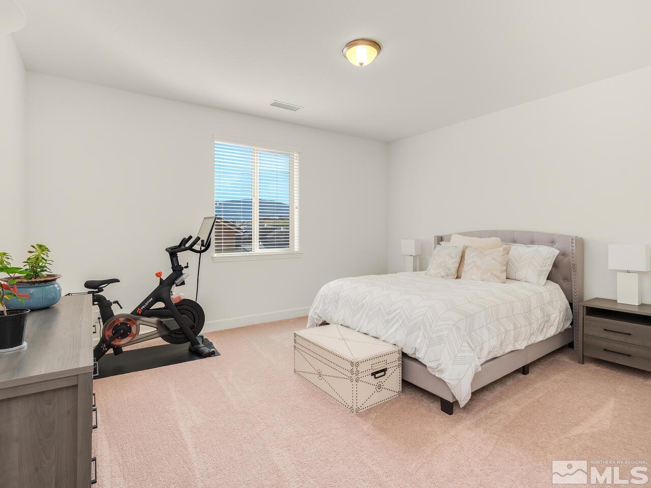 1770 Scott Valley Road Reno, NV 89523 - Photo 18 of 29 a bedroom with a bed and a table