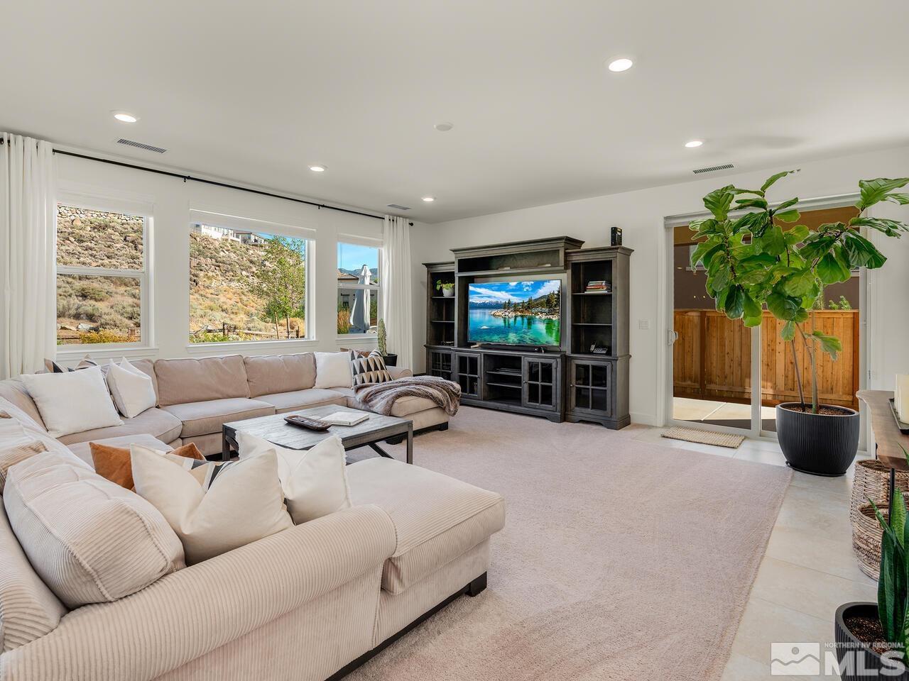 1770 Scott Valley Road Reno, NV 89523 - Photo 4 of 29 a living room with furniture and a flat screen tv