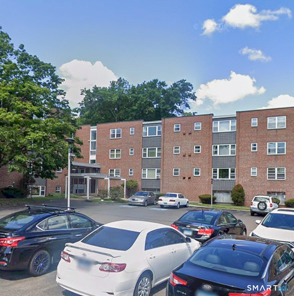 53 Wolcott Hill Road, Unit C12 Wethersfield, CT 06109 - Photo 4 of 25 a building view with couches and chairs
