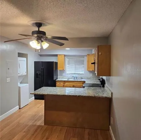 a view of living room with granite countertop furniture and a chandelier