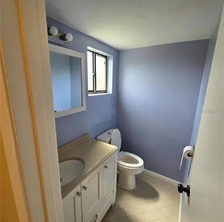 a bathroom with a toilet and a sink