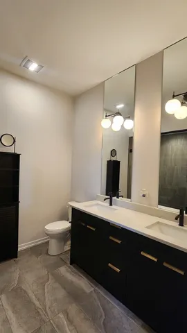 a view of a room with wooden floor and door