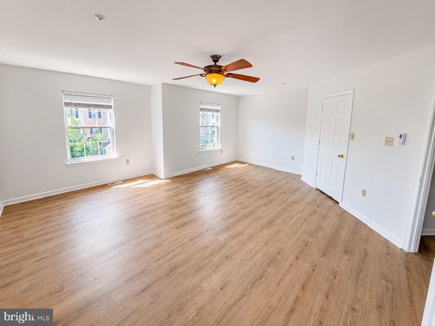308 Assembly Point Court Odenton, MD 21113 - Photo 13 of 19 a view of a room with wooden floor and window