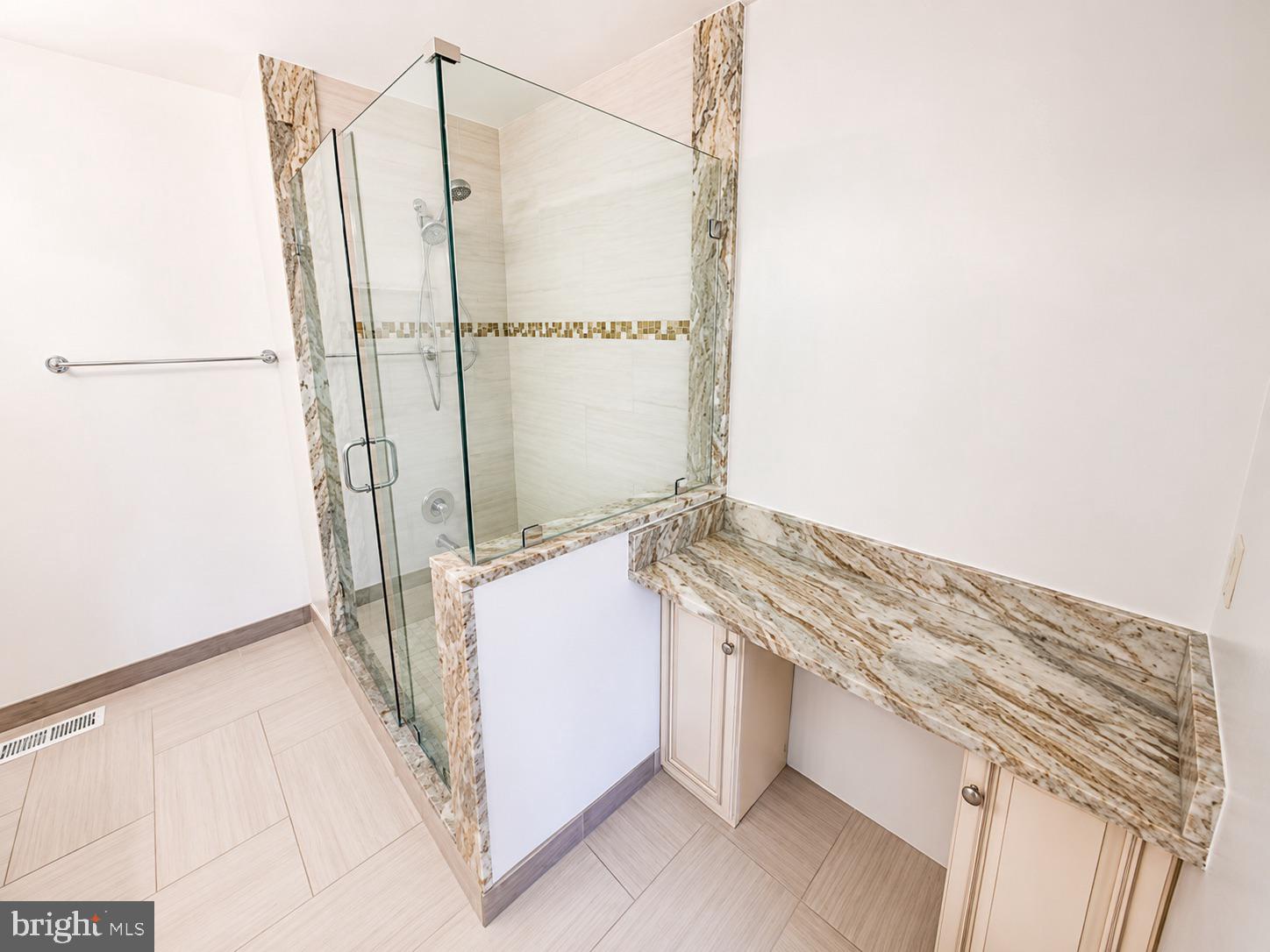 308 Assembly Point Court Odenton, MD 21113 - Photo 16 of 19 a bathroom with a bathtub and a shower