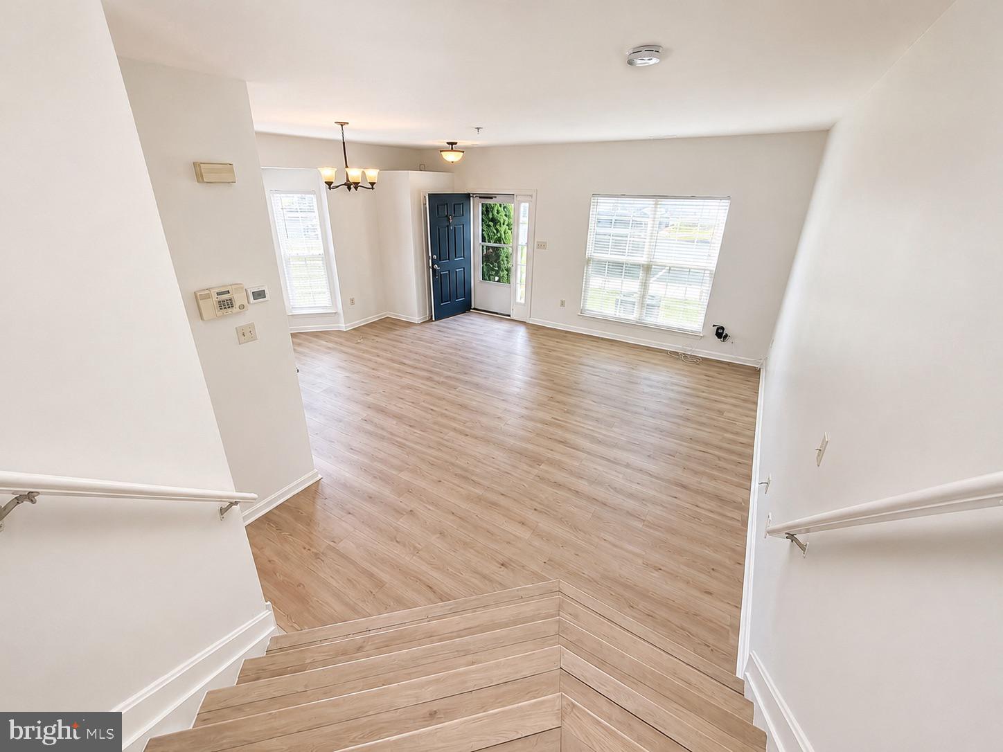 308 Assembly Point Court Odenton, MD 21113 - Photo 7 of 19 wooden floor in an empty room with a window