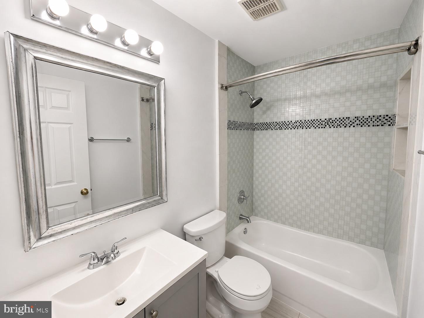308 Assembly Point Court Odenton, MD 21113 - Photo 10 of 19 a bathroom with a sink mirror toilet and bathtub