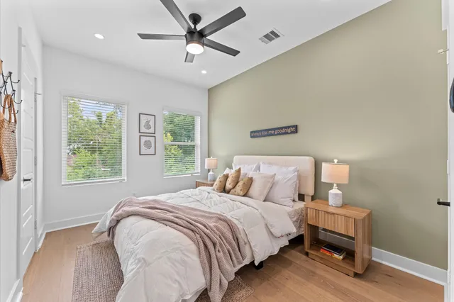 a bedroom with a bed and a window