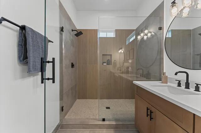 a bathroom with a sink and shower