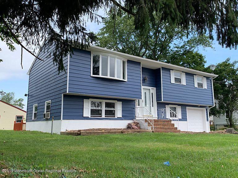 126 County Road Cliffwood, NJ 07721 - Photo 3 of 29 a front view of a house with a garden