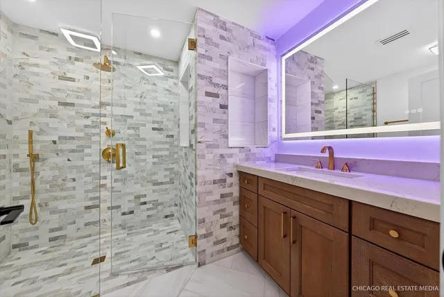 a view of kitchen with refrigerator and white cabinets