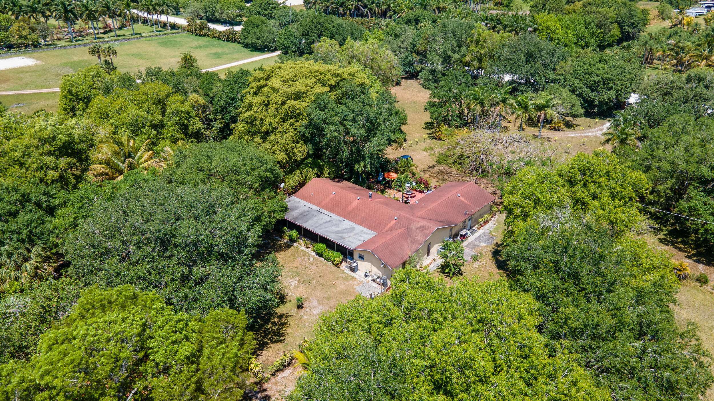 16688 Rustic Road Wellington, FL 33470 - Photo 11 of 14 an aerial view of a house with yard swimming pool and outdoor seating