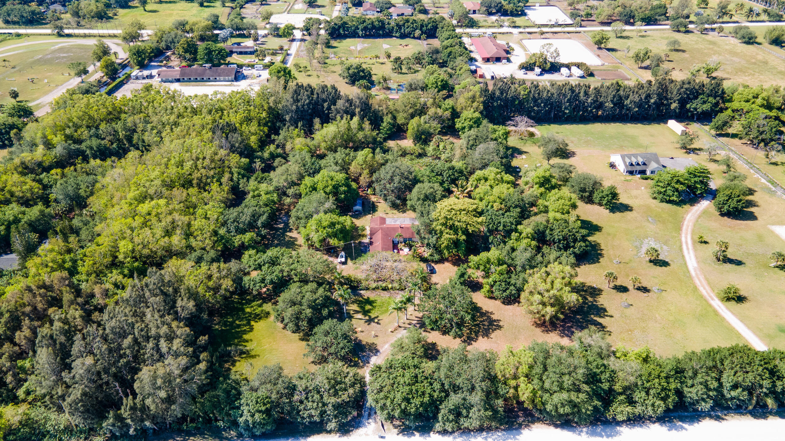 16688 Rustic Road Wellington, FL 33470 - Photo 13 of 14 an aerial view of residential houses with outdoor space and trees