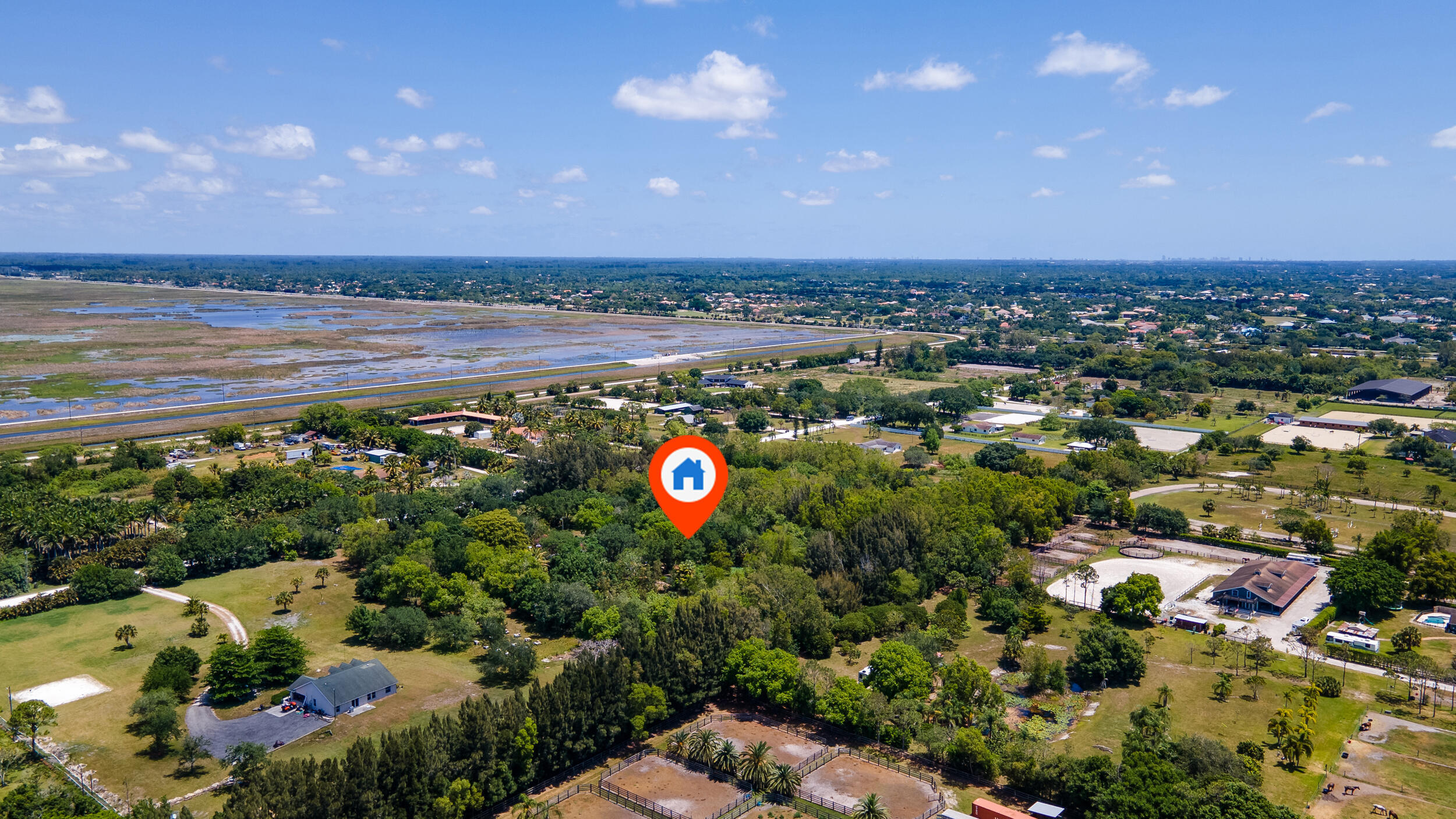16688 Rustic Road Wellington, FL 33470 - Photo 5 of 14 an aerial view of a houses with a yard