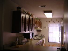 1671 Northeast Avery Palm Bay, FL 32905 - Photo 2 of 8 a kitchen with furniture and a window