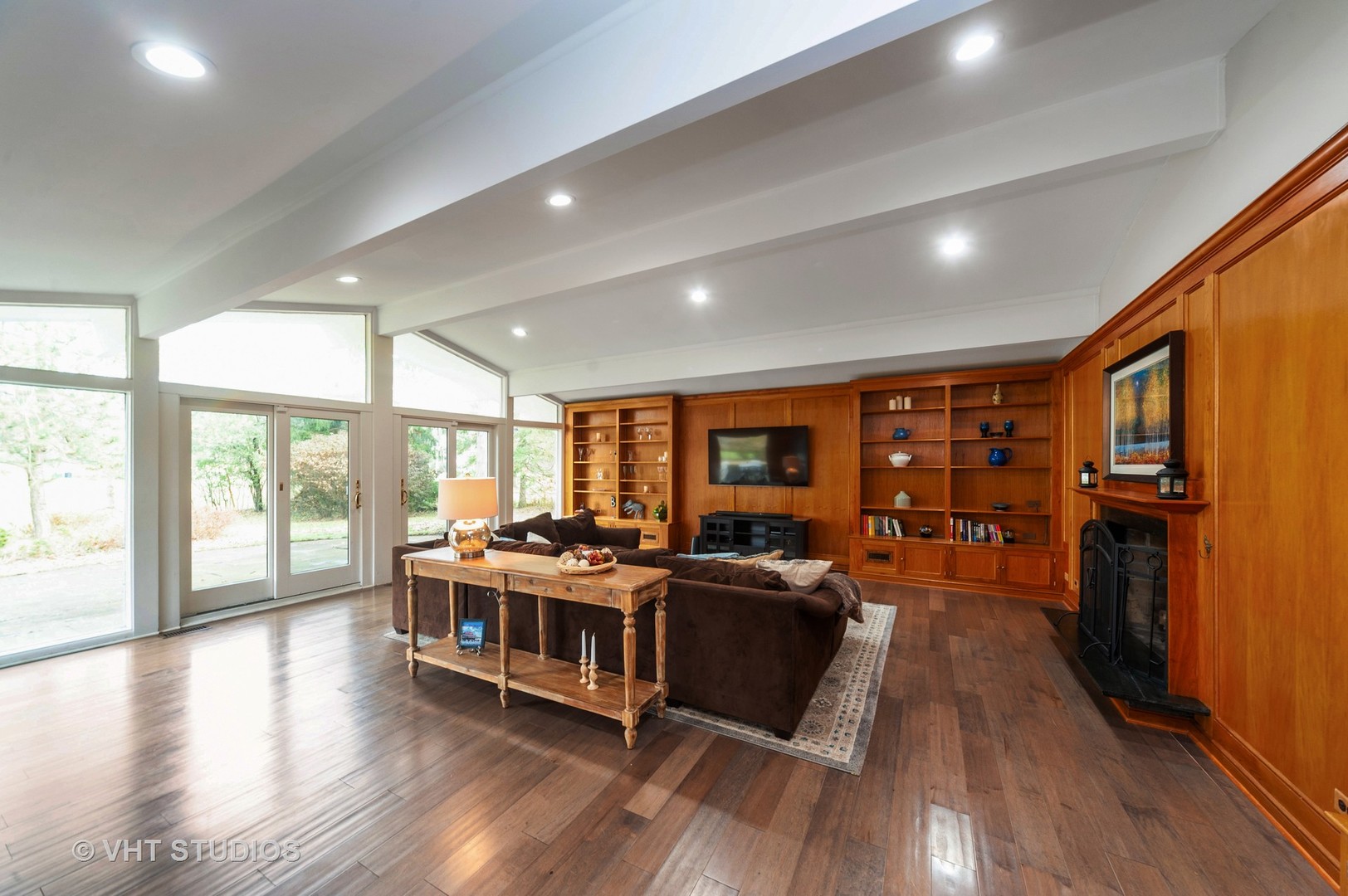 1555 Tower Road Winnetka, IL 60093 - Photo 2 of 27 a living room with furniture wooden floor and large windows