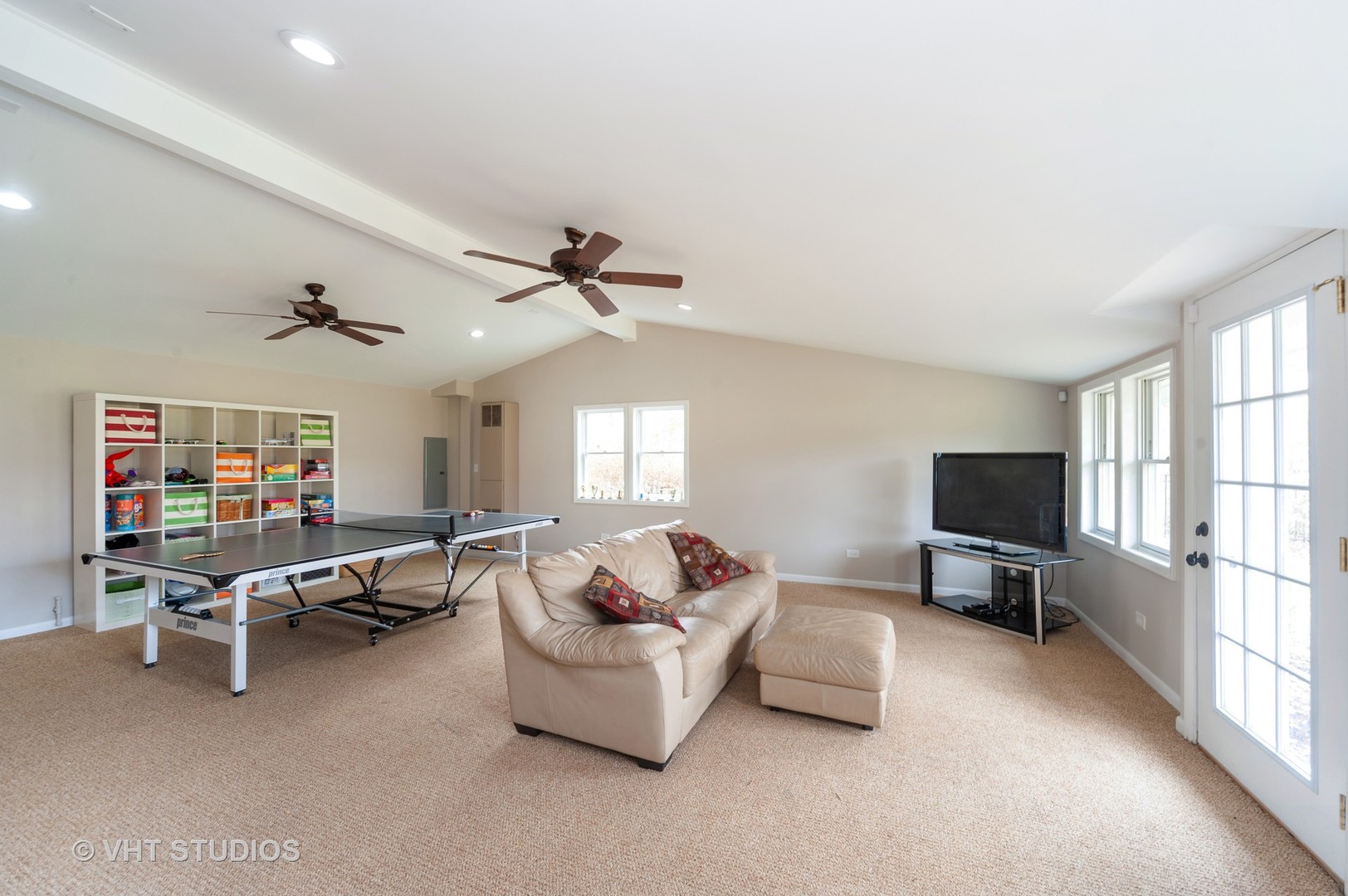 1555 Tower Road Winnetka, IL 60093 - Photo 12 of 27 a living room with furniture gym equipment and a window