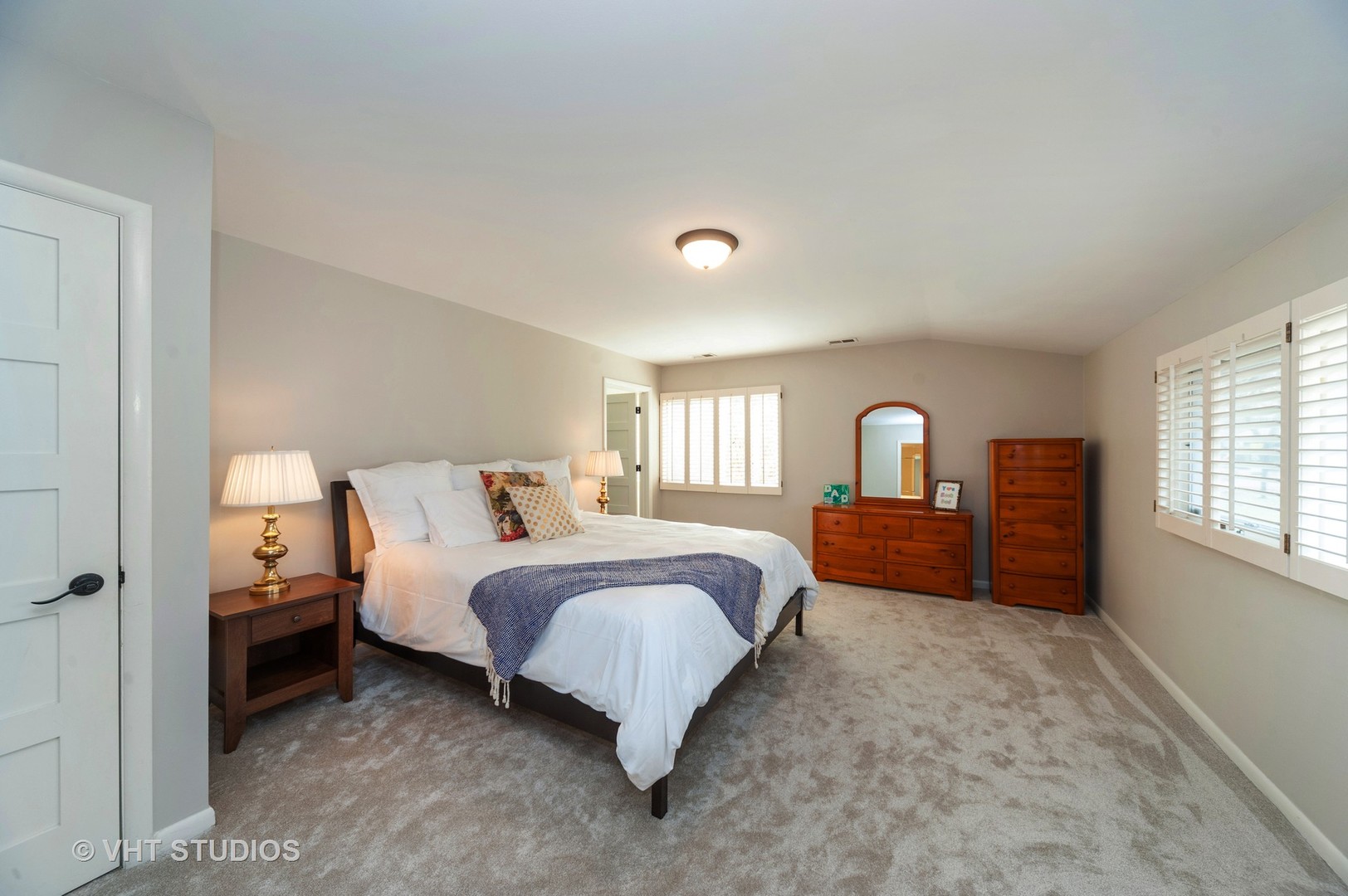 1555 Tower Road Winnetka, IL 60093 - Photo 14 of 27 a spacious bedroom with a bed and window