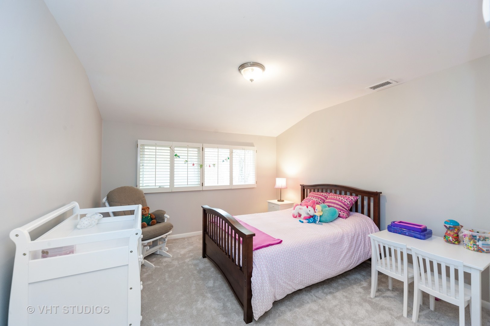 1555 Tower Road Winnetka, IL 60093 - Photo 17 of 27 a bedroom with a bed and window