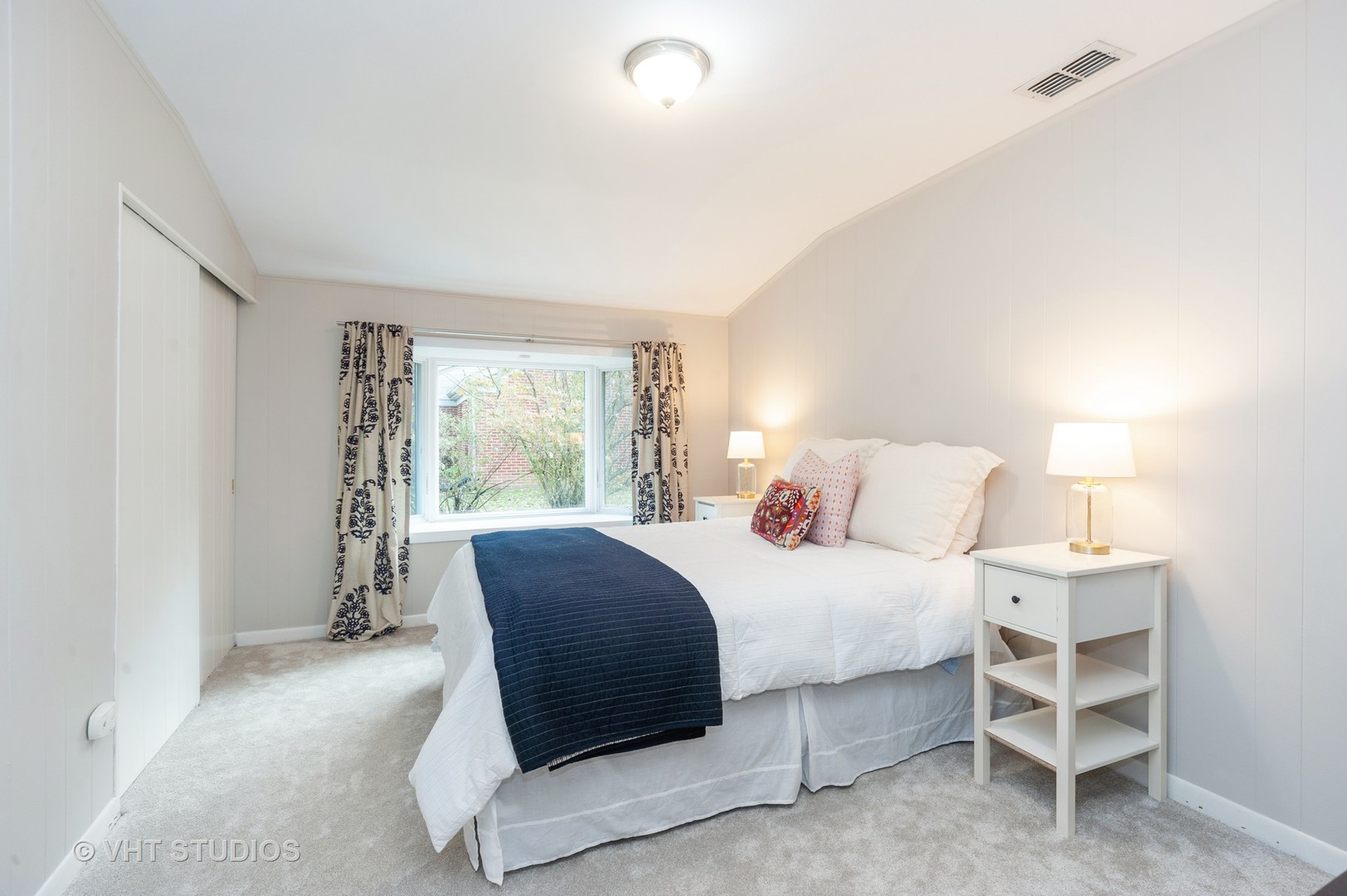 1555 Tower Road Winnetka, IL 60093 - Photo 18 of 27 a bedroom with a large bed and a window