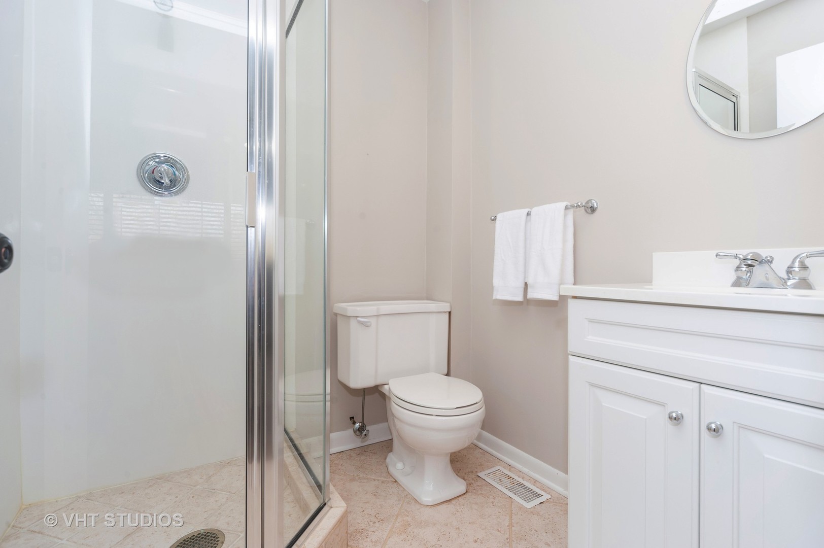 1555 Tower Road Winnetka, IL 60093 - Photo 21 of 27 a bathroom with a toilet and a shower
