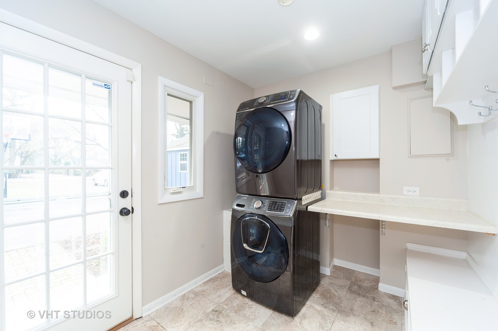 1555 Tower Road Winnetka, IL 60093 - Photo 22 of 27 a utility room with dryer and washer