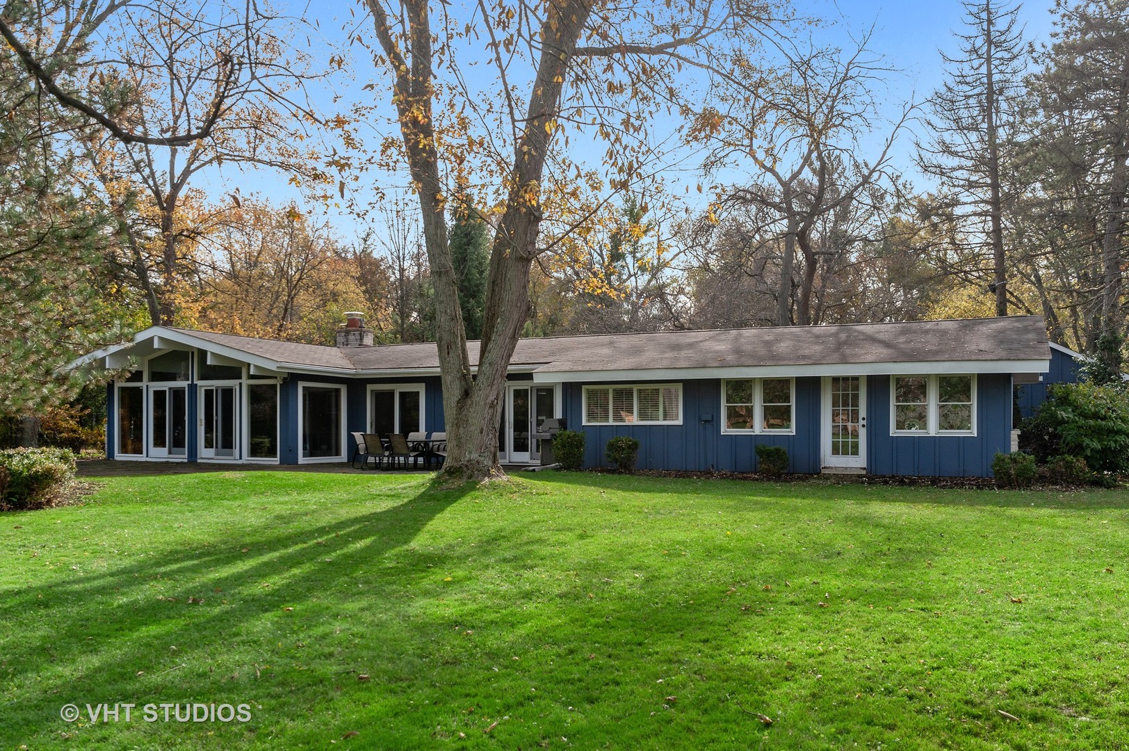 1555 Tower Road Winnetka, IL 60093 - Photo 24 of 27 front view of a house with a garden