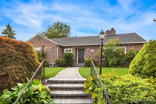 a front view of a house with garden