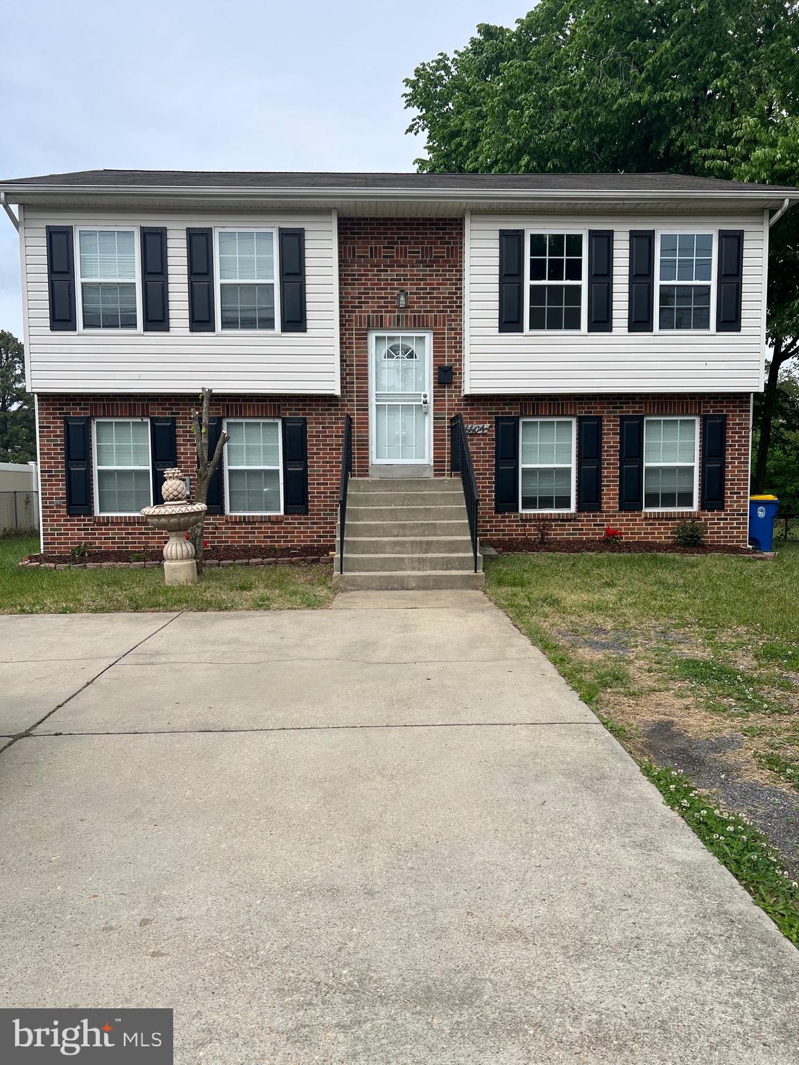6604 Suitland Road Suitland, MD 20746 - Photo 2 of 27 a front view of a house with garden