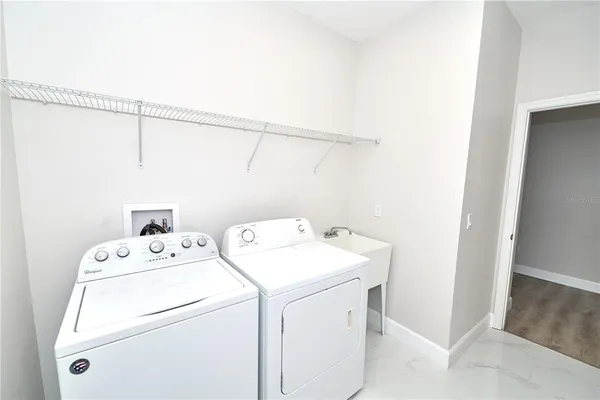 a view of a chairs and table in the patio