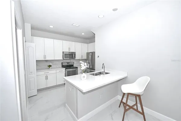a view of a room with wooden floor closet and a ceiling fan