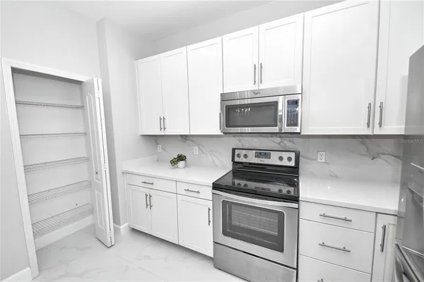 a bathroom with a bathtub and shower