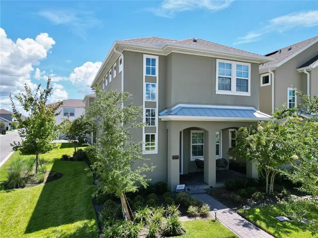 a front view of a house with garden
