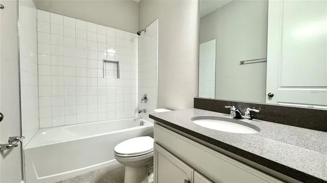 a close view of a utility room with dryer and washer