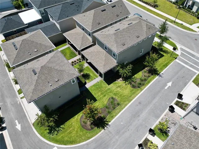 an aerial view of a house with a garden and plants