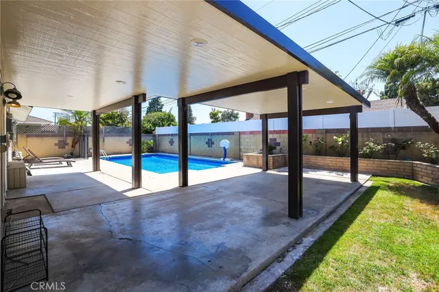 a swimming pool with outdoor seating