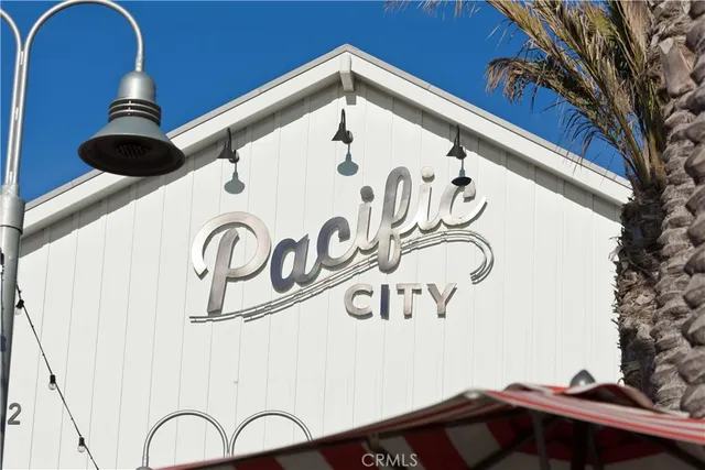 a front view of multiple houses with yard