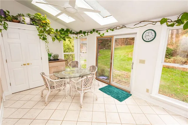 a view of a dining room with furniture window and outside view