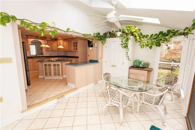 a view of a kitchen with furniture and a potted plant
