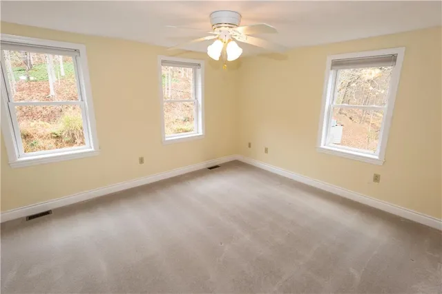 a view of an empty room with a window